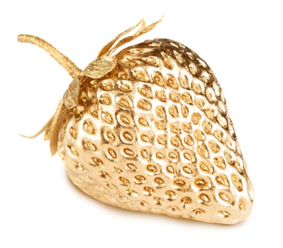 Gold strawberry isolated on white