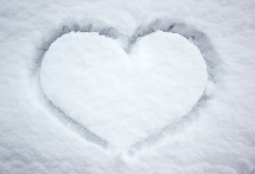 Heart shape in white snow