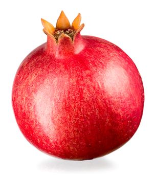 Ripe whole pomegranate isolated on white background