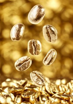 Gold coffee beans falling down