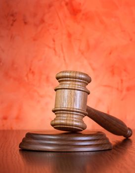 Judge gavel on brown wooden table