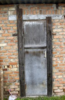 Old door on a brown brick wall great background.