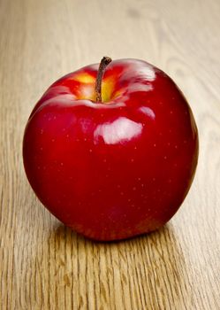 Red apple on wooden table