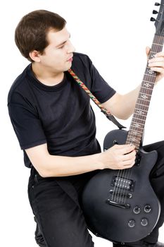 young man with an electric guitar. Isolated on white background