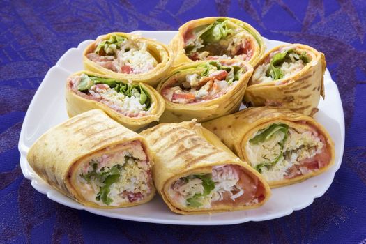 Rolls fried and chopped on the plate.