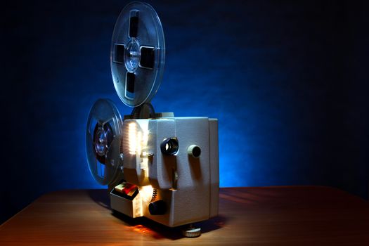 Vintage Film Projector in the Dusk on the Table