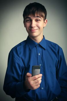 Vignetting Photo of Cheerful Teenager with Cellphone