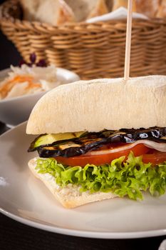 delicious vegan burger with ciabatta bread grilled eggplant and salad