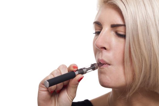 Close up Serious Facial Expression of a Young Blond Woman Smoking Using E- Cigarette on a White Background