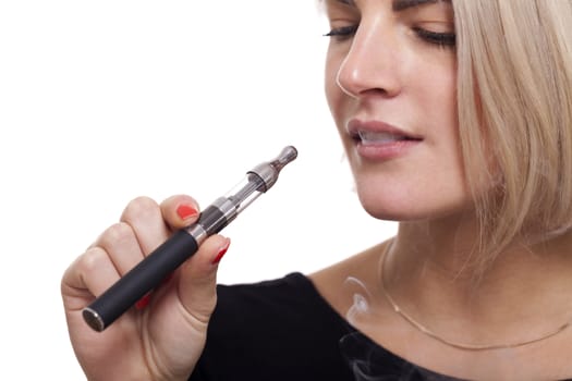 Close up Serious Facial Expression of a Young Blond Woman Smoking Using E- Cigarette on a White Background