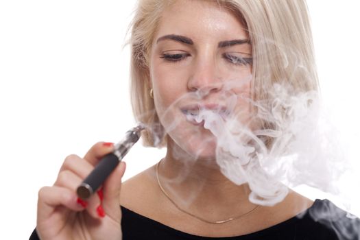 Close up Serious Facial Expression of a Young Blond Woman Smoking Using E- Cigarette on a White Background