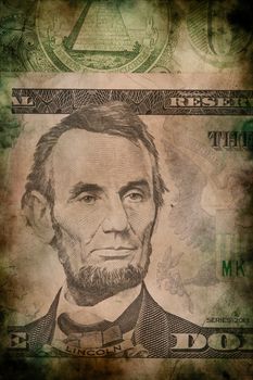 Macro of Abraham Lincoln on five USA one dollar banknote grunge vintage style