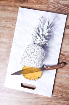 Fancy, white pineapple on the board