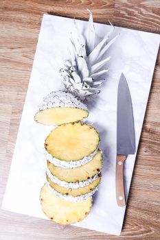 Fancy, white pineapple on the board