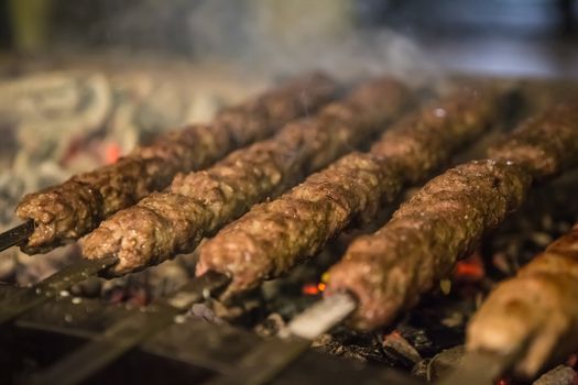 tikka, shish and kofta kebabs on charcoal barbecue