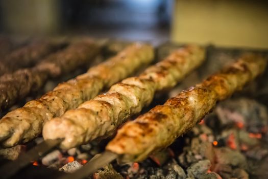 tikka, shish and kofta kebabs on charcoal barbecue