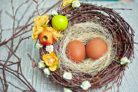 eggs in nest on a wooden background for easter