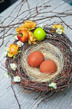 eggs in nest on a wooden background for easter