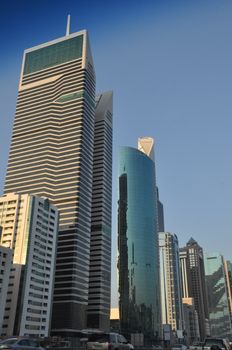 View of Sheikh Zayed Road skyscrapers in Dubai, UAE.  The Sheikh Zayed Road (E11 highway) is home to most of Dubai's skyscrapers, including the Emirates Towers.