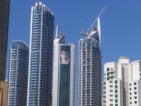 View of Sheikh Zayed Road skyscrapers in Dubai, UAE.  The Sheikh Zayed Road (E11 highway) is home to most of Dubai's skyscrapers, including the Emirates Towers.