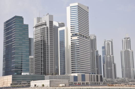 View of Sheikh Zayed Road skyscrapers in Dubai, UAE.  The Sheikh Zayed Road (E11 highway) is home to most of Dubai's skyscrapers, including the Emirates Towers.