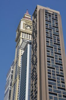 View of Sheikh Zayed Road skyscrapers in Dubai, UAE. The Sheikh Zayed Road (E11 highway) is home to most of Dubai's skyscrapers, including the Emirates Towers.