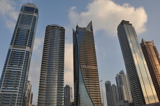 View of Sheikh Zayed Road skyscrapers in Dubai, UAE. The Sheikh Zayed Road (E11 highway) is home to most of Dubai's skyscrapers, including the Emirates Towers.