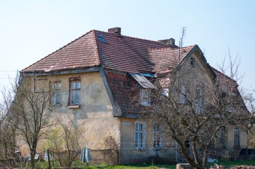 Old ruined, German House in the village. Spring season.