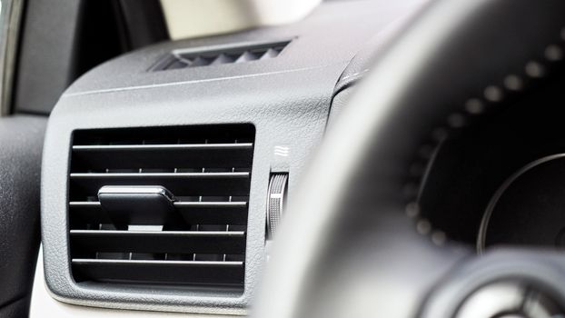 interior of black luxury car air conditioning 