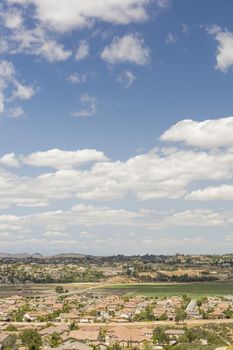 Elevated View of New Contemporary Suburban Neighborhood and Majestic Clouds.