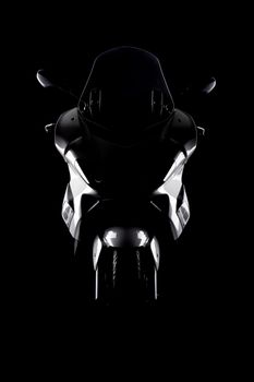 silhouette of a motorcycle against black background