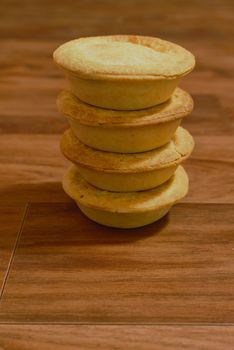 Stack of meat pies freshly baked.