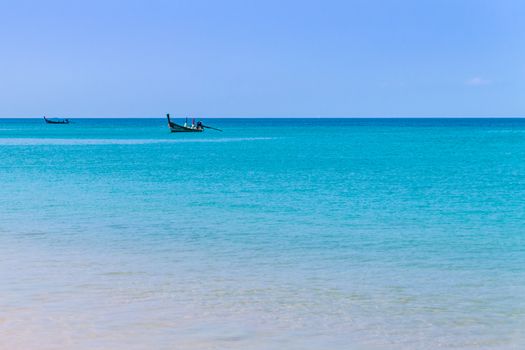 Long tailed boat at distance in Thailand