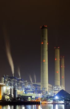 power station at night with smoke, hong kong