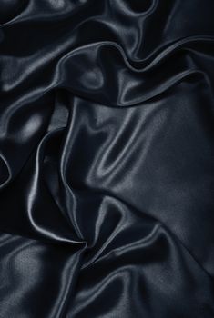 Smooth elegant black silk or satin can use as background 