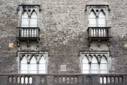 old windows with balcony at kilkenny castle in ireland