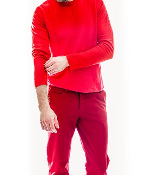 Elegant young handsome man in red clothing. Studio fashion portrait.