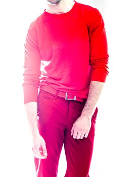 Elegant young handsome man in red clothing. Studio fashion portrait.