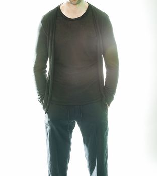 Elegant young handsome man in black clothing. Studio fashion portrait.