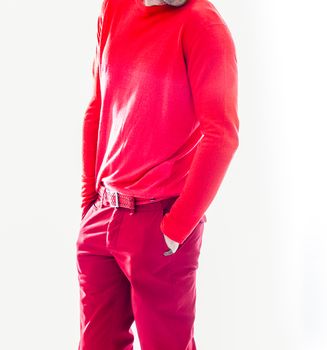 Elegant young handsome man in red clothing. Studio fashion portrait.