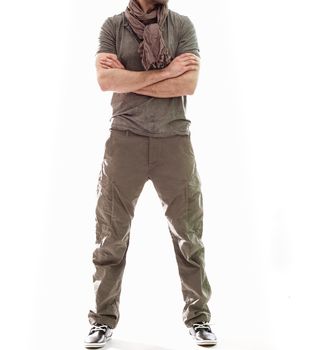 Elegant young handsome man in gray clothing. Studio fashion portrait.