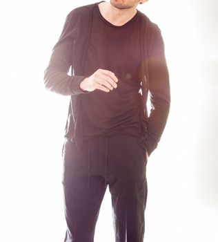 Elegant young handsome man in black clothing. Studio fashion portrait.