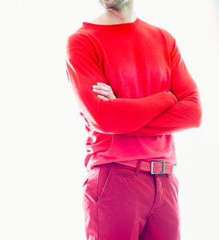 Elegant young handsome man in red clothing. Studio fashion portrait.