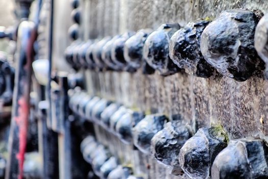 Industrial abstract background texture with black steel structure with bolts and rivets