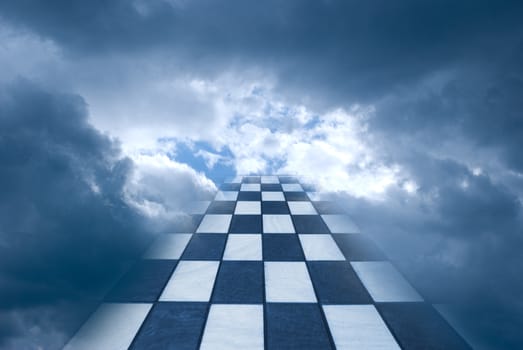 Chess board on a background of the dark blue sky.