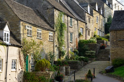 The medieval architecture of the old Cotswold cottages of the Chipping Steps in Tetbury in Gloucestershire in the Cotswolds, England.