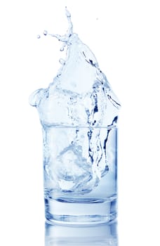 Splash from ice cube in a glass of water, isolated on the white 