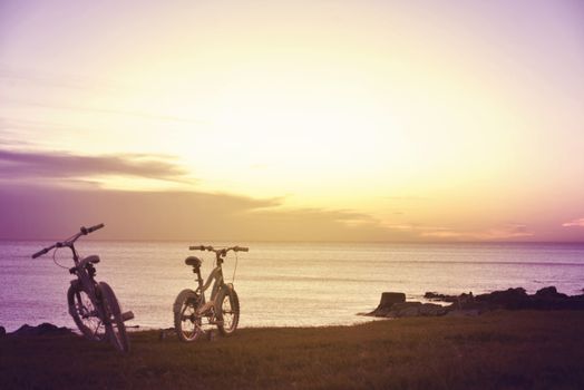 Hipster family fun bikes at sunset. Enjoy summer concept photography.