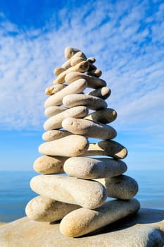 Balancing of stones each other on the seashore