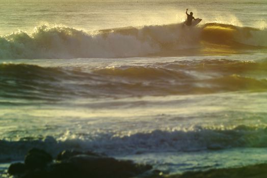 Retro summer surf at sunset beach.